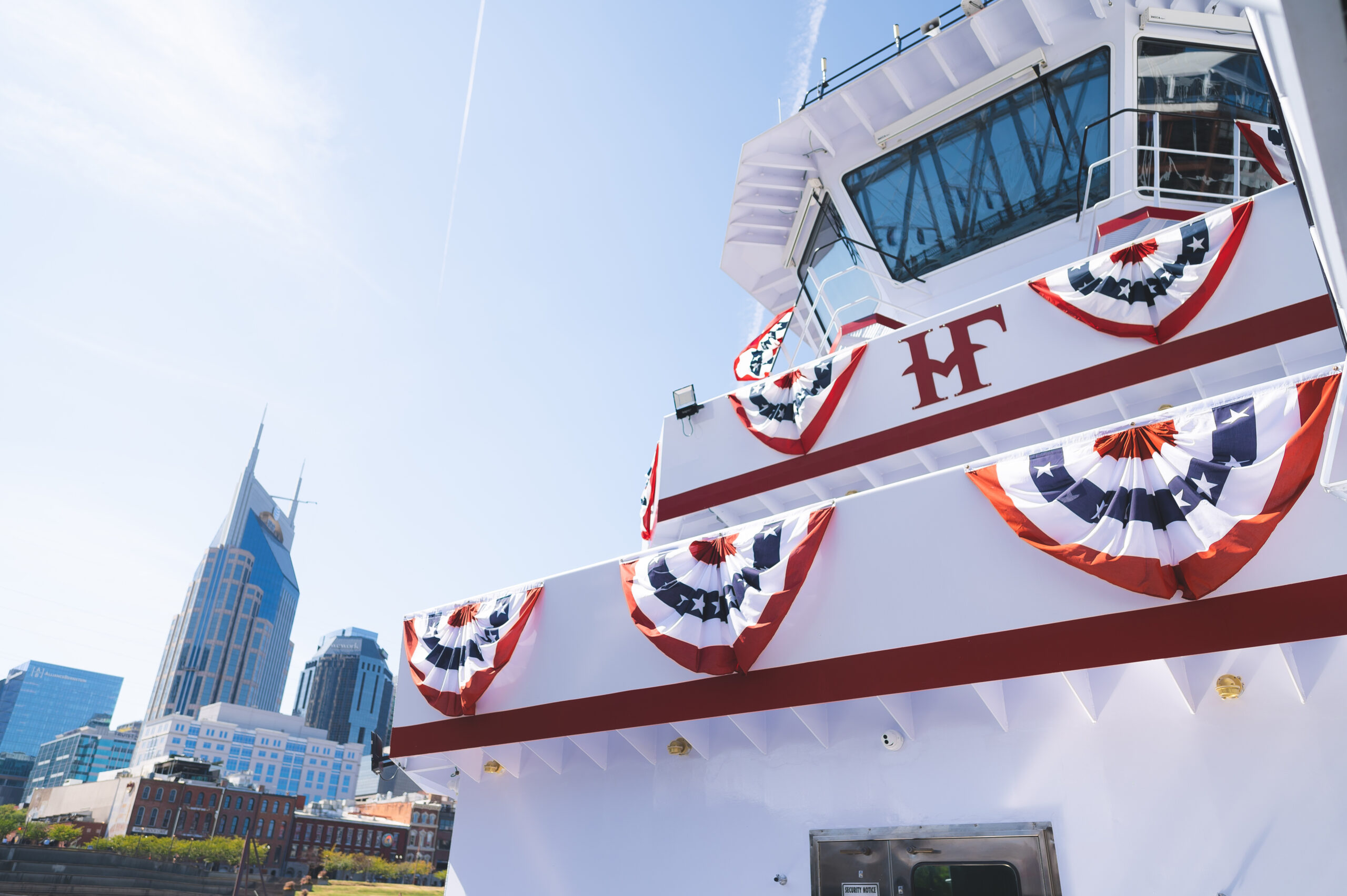 Hines Furlong Line towboat docked in Nashville with patriotic trim